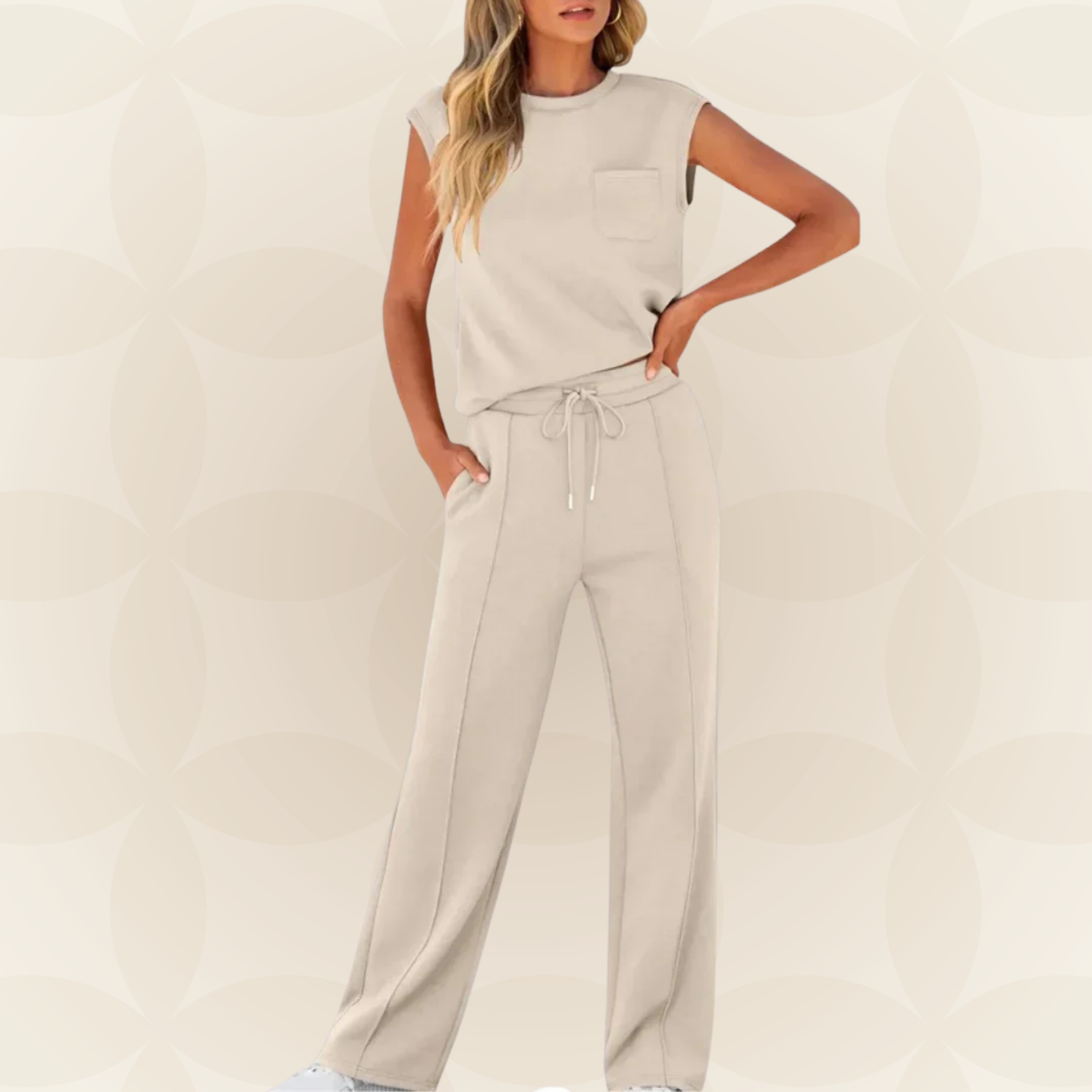 Ensemble femme élégant avec top sans manches et pantalon large fluide