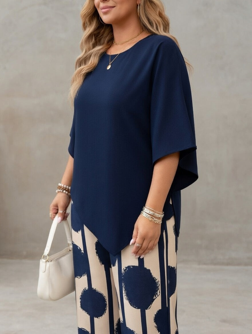 Ensemble femme élégant avec top asymétrique fluide et pantalon imprimé