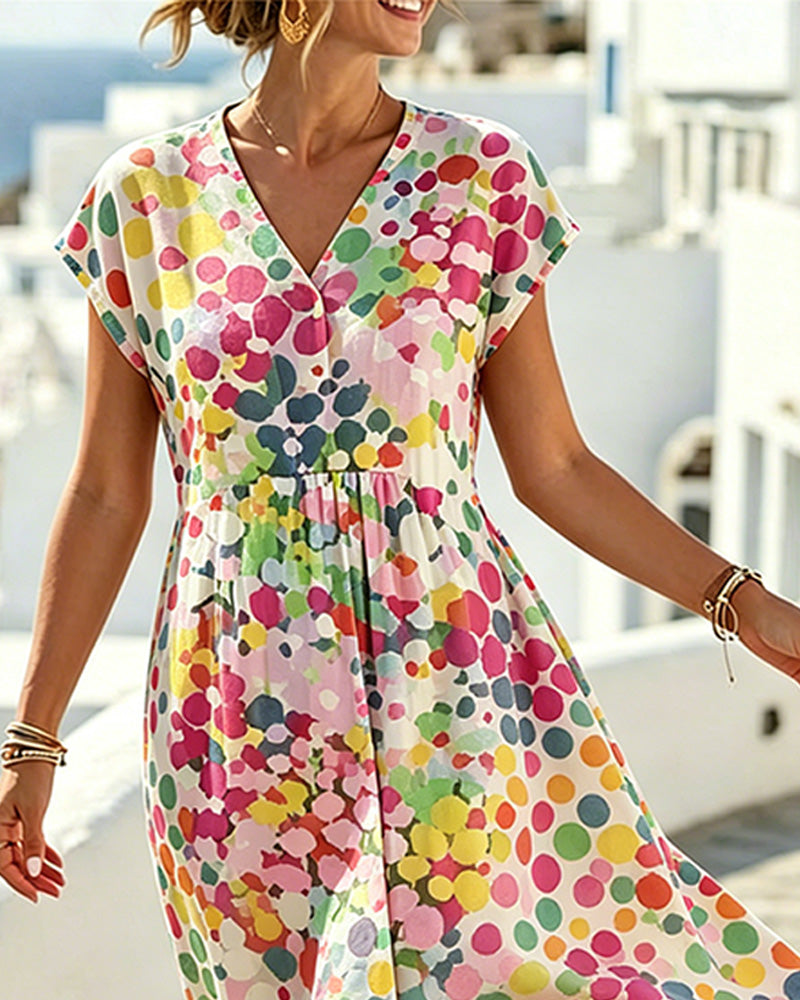 Robe féminine à pois colorés et décolleté en V fluide