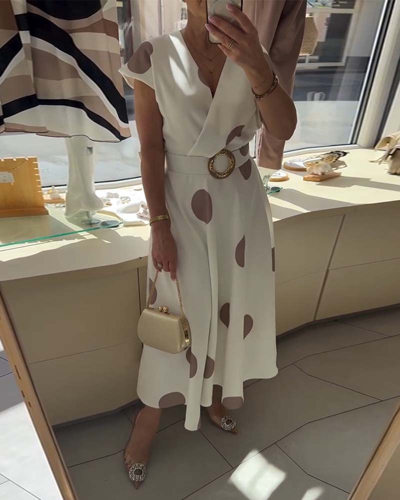 Robe femme à pois avec col V croisé et taille ceinturée