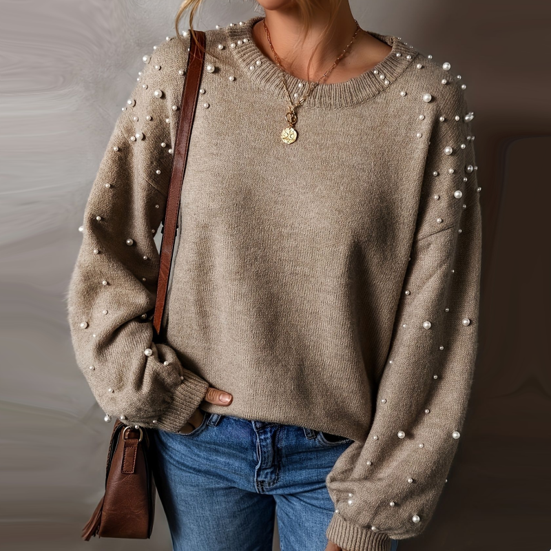 Pull femme à perles et manches bouffantes
