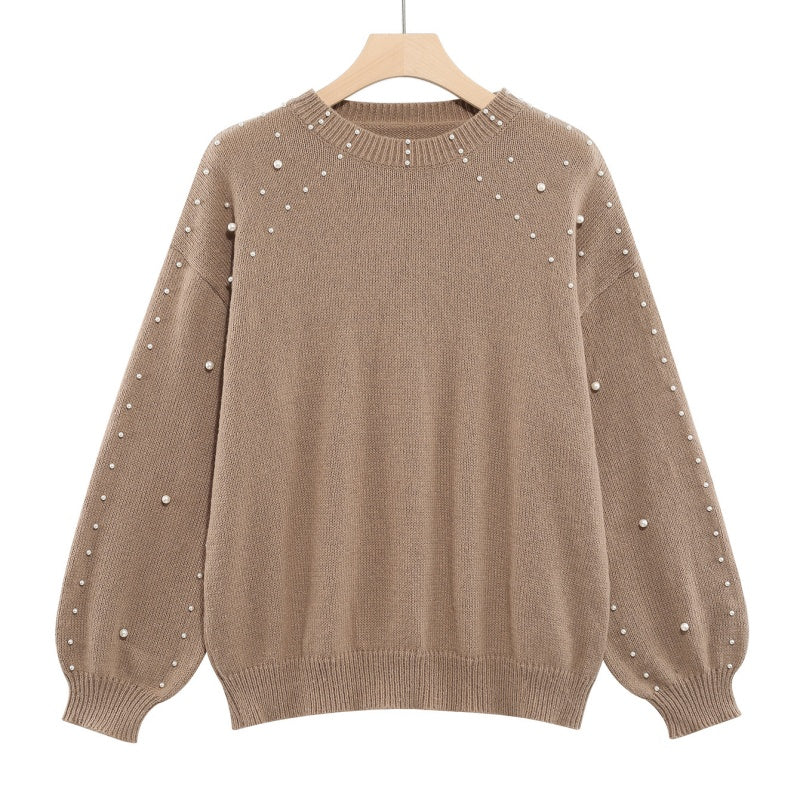 Pull femme à perles et manches bouffantes
