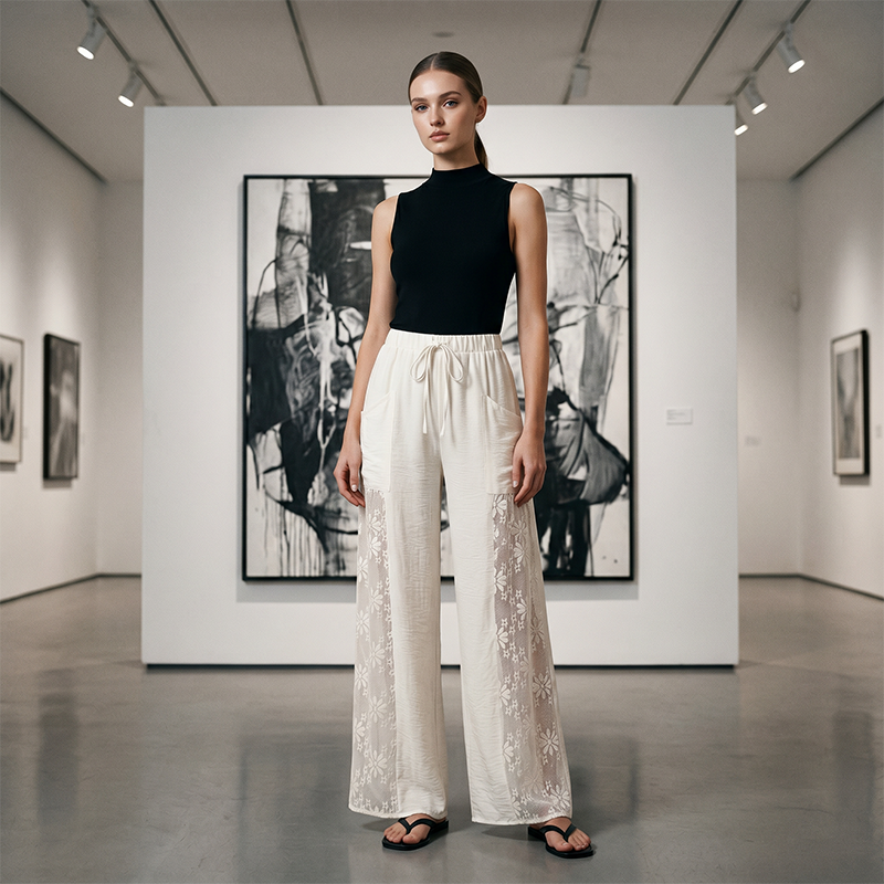 Pantalon femme fluide noir avec dentelle florale et cordon