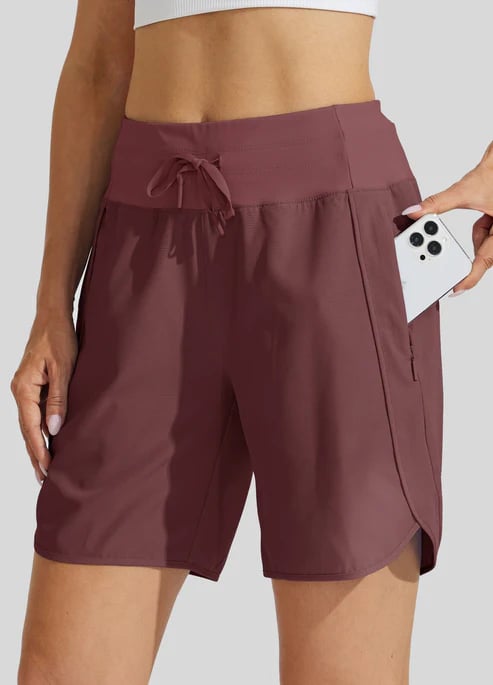 Short sport femme taille haute avec cordon et poches