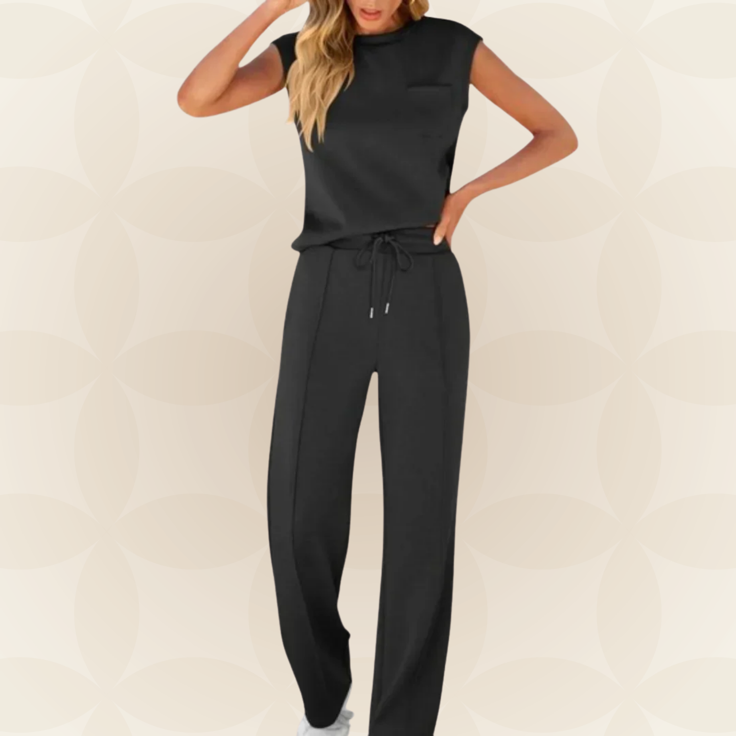 Ensemble femme élégant avec top sans manches et pantalon large fluide