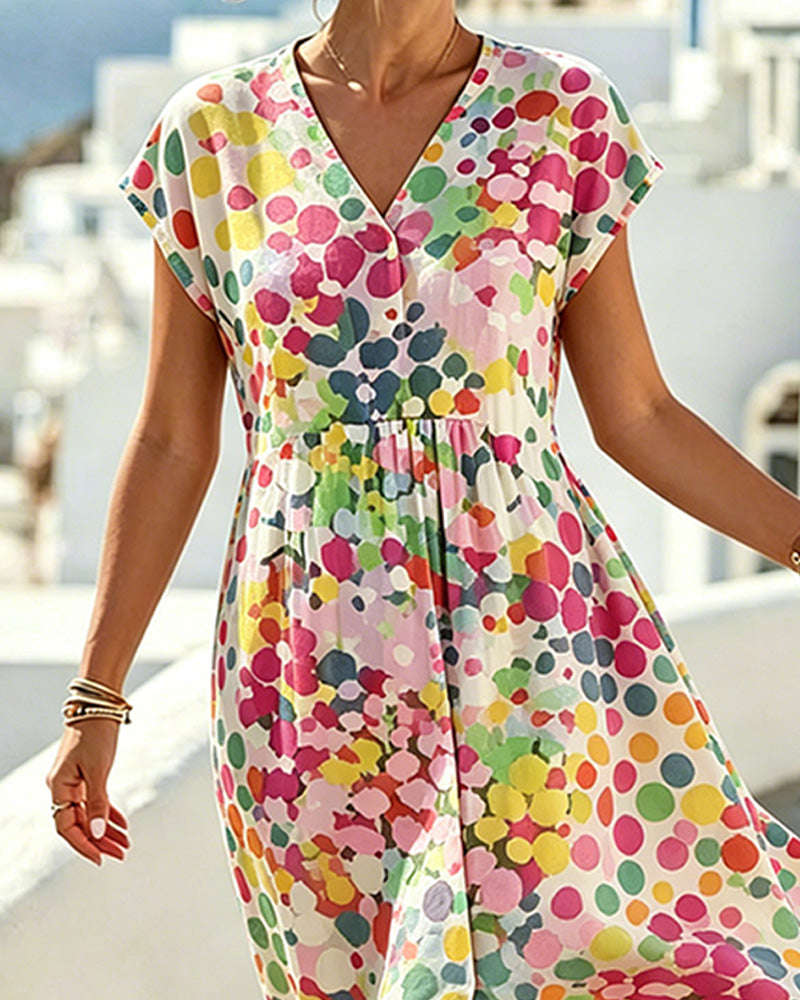 Robe féminine à pois colorés et décolleté en V fluide