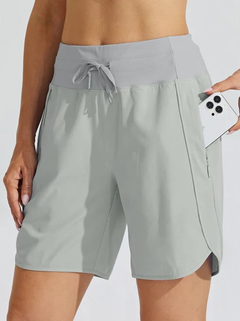 Short sport femme taille haute avec cordon et poches